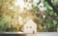 Wooden miniature house with beautiful nature background Royalty Free Stock Photo