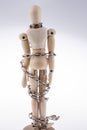 Wooden model man in chains Royalty Free Stock Photo