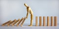 Wooden model of man stopping wooden domino blocks with Inscriptions `covid`. Beautiful white background, copy space. COVID-19 Royalty Free Stock Photo