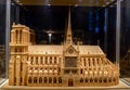 Wooden model Notre Dame de Paris under glass dome side view