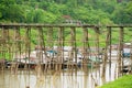 Wooden Mon Bridge across Song Kalia river in Sangkhlaburi, Thailand.