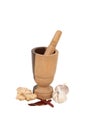 Wooden mortar, chillis, ginger and garlic Royalty Free Stock Photo
