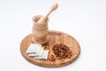 Wooden mortar and dog rose tea on the wooden spoon Royalty Free Stock Photo