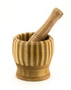 Wooden mortar and pestle for grinding and crushing herbs Royalty Free Stock Photo