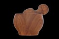 Wooden mortar with pestle isolated on black background