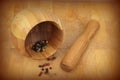 Wooden mortar and pestle with pepper mix Royalty Free Stock Photo