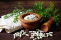 wooden mortar and pestle set with homeopathic medicines Royalty Free Stock Photo