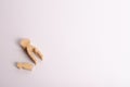 Wooden mother figures with a hollow inside in the shape of a child and a child`s figurine lie on a white background.