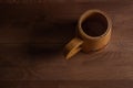 Wooden mug on a wooden table. Wooden dishes.