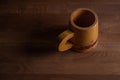 Wooden mug on a wooden table. Wooden dishes.