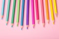 Wooden multi-colored pencils close-up pink background Royalty Free Stock Photo