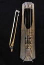 Wooden musical bowed harp instrument of talharpa