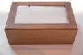 Wooden napkin holder with paper serviettes . Wooden brown empty napkin box . wooden stand with salt shaker, napkins on a wooden Royalty Free Stock Photo