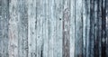 Wooden natural background. Fragment of old wooden house wall cladding with blue and blue peeling paint Royalty Free Stock Photo