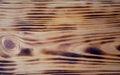 Wooden natural brown background with scars and patterns. Wooden slats. Burned Tree