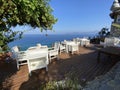 Wooden natural seats and desk with sea view. Royalty Free Stock Photo