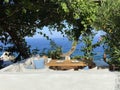 Wooden natural seats and desk with sea view. Royalty Free Stock Photo