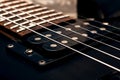 Wooden neck of a black guitar close up Royalty Free Stock Photo