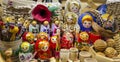 Wooden nesting dolls and other Russian folk souvenirs are on the counter. selective focus Royalty Free Stock Photo