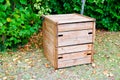 Wooden new garden compost bin of organic material composter Royalty Free Stock Photo