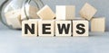 Wooden news sign on a table in an office Royalty Free Stock Photo