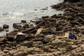 Wooden North Korean fishing boats thrown by a storm onto a rocky shore near Vladivostok