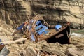 Wooden North Korean fishing boats thrown by a storm onto a rocky shore near Vladivostok