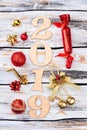 Wooden number 2019 and Christmas ornaments. Royalty Free Stock Photo