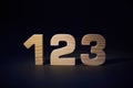 Wooden numbers 123 on a black background