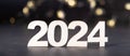 2024 wooden numbers with bokeh background. Happy new year 2024 banner