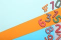 Wooden numbers on colorful background, flat lay. Space for text Royalty Free Stock Photo