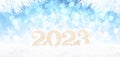 Wooden 2023 Numbers on Snowy Background