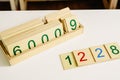 Wooden numbers in tables to learn mathematics in a Montessori classroom