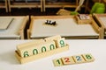 Wooden numbers in tables to learn mathematics in a Montessori classroom