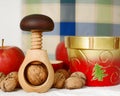 Wooden nutcracker, nuts, bowl and apples