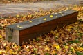 A wooden oak prism serves as a bench in the garden. for better drying of the wood, grooves are milled in the lower part, which pre Royalty Free Stock Photo
