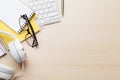 Wooden office desk with computer and supplies Royalty Free Stock Photo