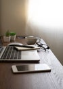 Wooden office desk table with keyboard of laptop, coffee cup and notebook, mouse computer Royalty Free Stock Photo