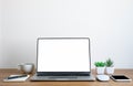 Wooden office desk table with keyboard of laptop, coffee cup and notebook Royalty Free Stock Photo