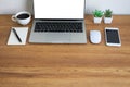 Wooden office desk table with keyboard of laptop, coffee cup and notebook, mouse computer Royalty Free Stock Photo