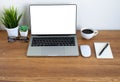 Wooden office desk table with keyboard of laptop, coffee cup and notebook Royalty Free Stock Photo