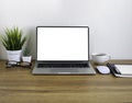 Wooden office desk table with keyboard of laptop, coffee cup and notebook Royalty Free Stock Photo