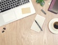 For design wooden office desk table with laptop computer, green plant, pen, and a cup of black coffee. Top view with copy space, f Royalty Free Stock Photo