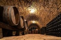 Wooden old barrels in the rustic wine cellar with brick walls in hajos hungary