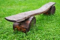 Wooden old bench on a background of green grass Royalty Free Stock Photo