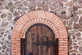 Wooden old door in brick wall background Royalty Free Stock Photo