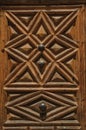 Wooden old door with geometric decoration at Avila