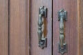 Wooden old grey wardrobe with two metal handles as background Royalty Free Stock Photo