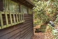 Wooden, old house in the woods in autumn scenery, shelter in the woods. Royalty Free Stock Photo