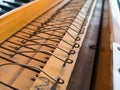 wooden old piano wire close up shot